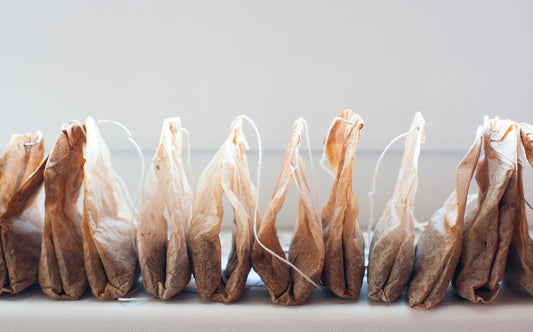 Used tea bags browned depicting how wasteful they can be, and potentially harmful to our environment.