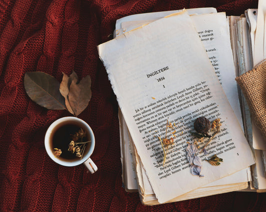 Chai tea with leaves and a book